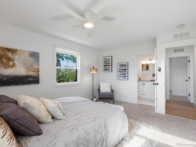 15229 Navajo St, Broomfield, CO 80023 - bedroom with light carpet, connected bathroom, and ceiling fan