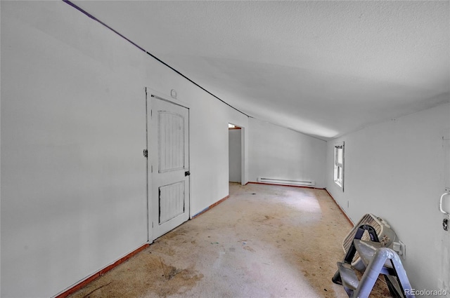 200 Rd P37, Bailey, CO 80421 - unfurnished room with a baseboard radiator, unfinished concrete flooring, and a textured ceiling
