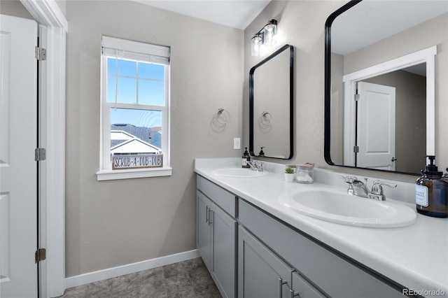 10228 Wrangell Cir, Colorado Springs, CO 80924 - bathroom with double vanity and baseboards