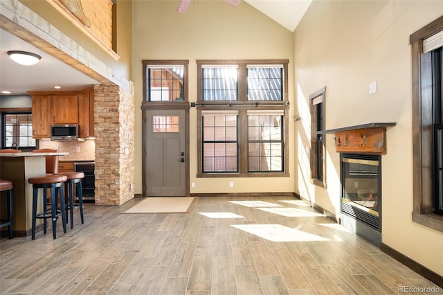 127 Silver Sage Rd, Granby, CO 80446 - entrance foyer featuring light wood-style floors, baseboards, and high vaulted ceiling