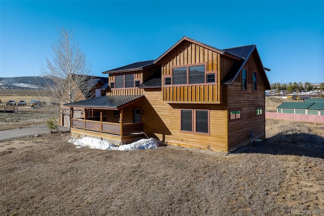 127 Silver Sage Rd, Granby, CO 80446 - rear view of property with covered porch, board and batten siding, and metal roof