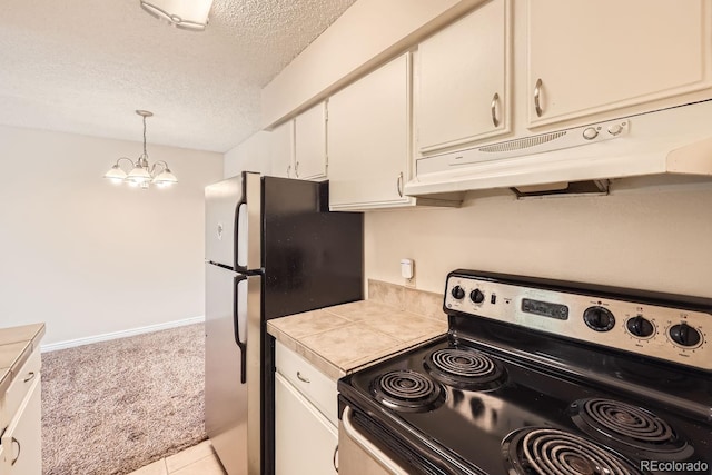 kitchen featuring black appliances, hanging light fixtures, tile counters, light colored carpet, and a chandelier