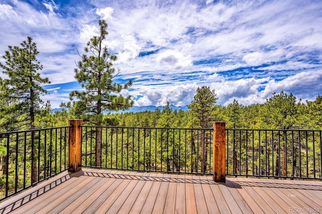 4513 County Road 323, Westcliffe, CO 81252 - wooden terrace featuring a wooded view