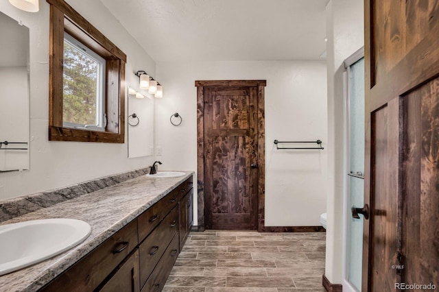 4513 County Road 323, Westcliffe, CO 81252 - bathroom featuring double vanity and toilet