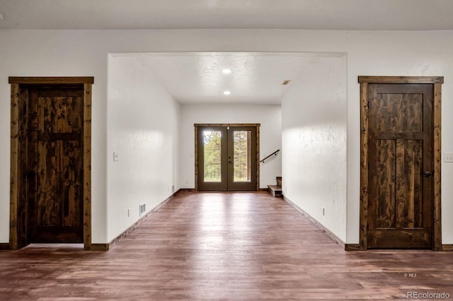 4513 County Road 323, Westcliffe, CO 81252 - entrance foyer featuring wood finished floors, french doors, and stairs