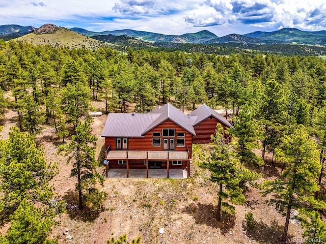 4513 County Road 323, Westcliffe, CO 81252 - view of subject property featuring a mountain backdrop and a forest