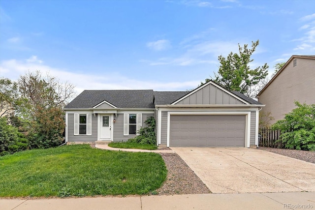 904 Clover Cir, Lafayette, CO 80026 - view of front of property featuring an attached garage, concrete driveway, and board and batten siding
