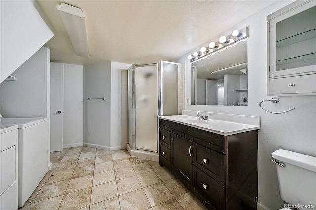 904 Clover Cir, Lafayette, CO 80026 - full bathroom with washer and dryer, vanity, a shower stall, and toilet