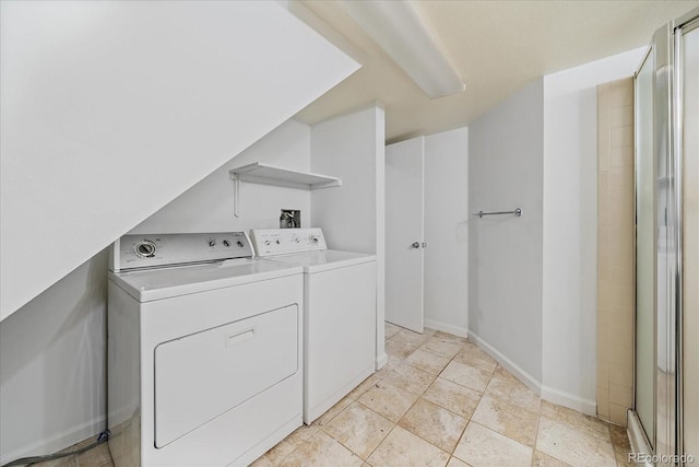 904 Clover Cir, Lafayette, CO 80026 - laundry area featuring washer and clothes dryer and baseboards