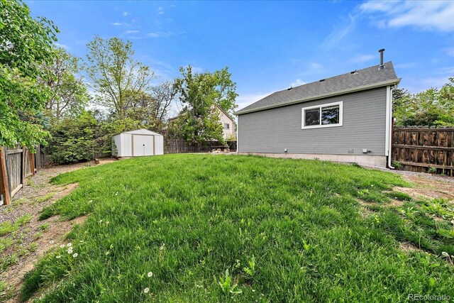 904 Clover Cir, Lafayette, CO 80026 - view of yard featuring a storage unit and an outbuilding