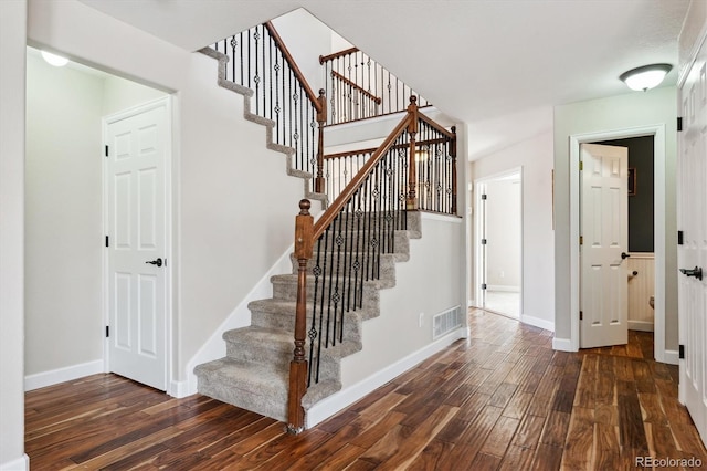 stairway with wood-type flooring