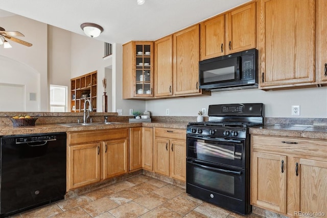 kitchen featuring black appliances, ceiling fan, and sink