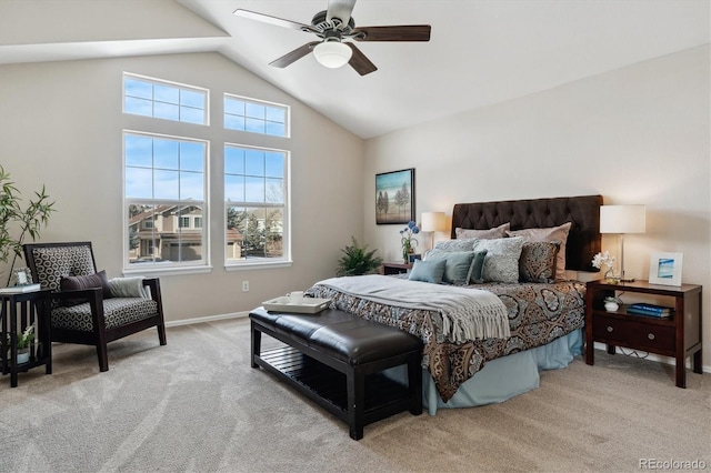 carpeted bedroom with ceiling fan and vaulted ceiling