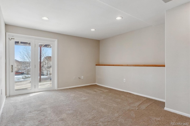 empty room featuring light carpet