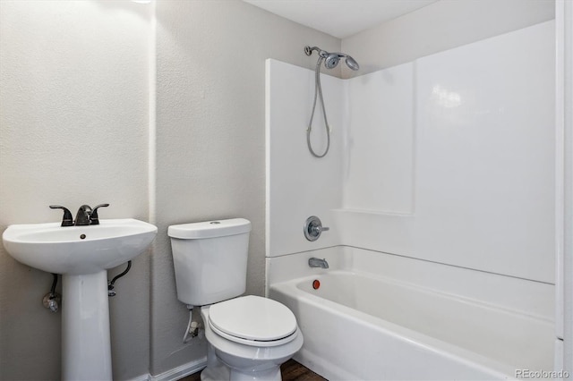 full bathroom featuring sink, toilet, and shower / washtub combination