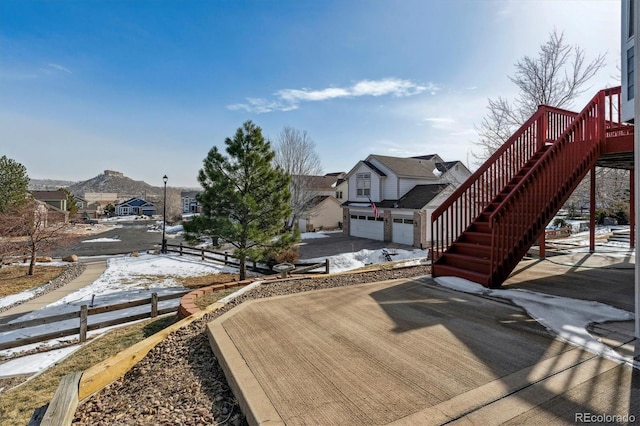 snow covered deck featuring a mountain view