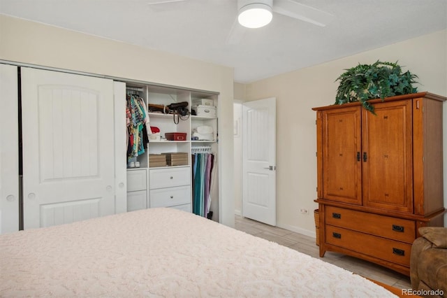 bedroom with ceiling fan and light wood-type flooring