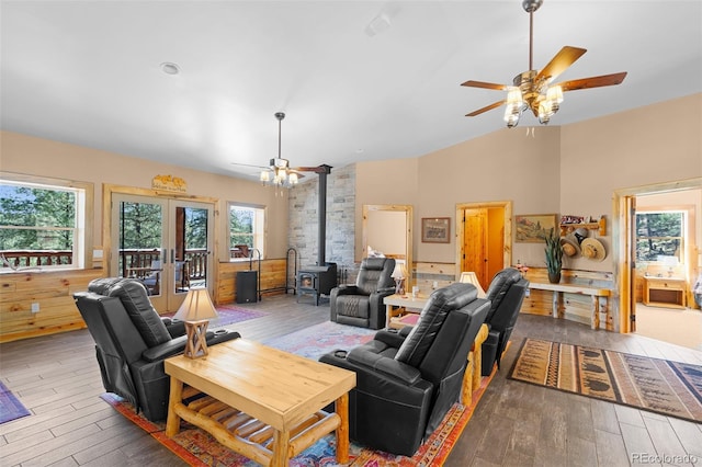 14552 Timber Valley Dr, Weston, CO 81091 - living area featuring a ceiling fan, a wood stove, healthy amount of natural light, and lofted ceiling