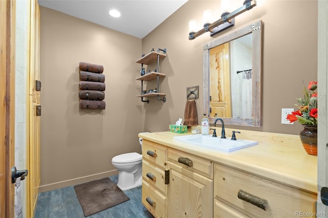 14552 Timber Valley Dr, Weston, CO 81091 - bathroom featuring toilet, baseboards, and vanity