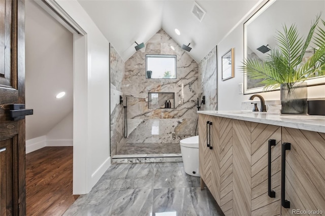1024 W 8th Ave, Denver, CO 80204 - bathroom featuring vanity, a marble finish shower, toilet, vaulted ceiling, and baseboards