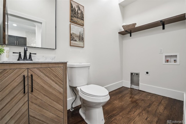 1024 W 8th Ave, Denver, CO 80204 - half bath featuring baseboards, toilet, wood finished floors, and vanity