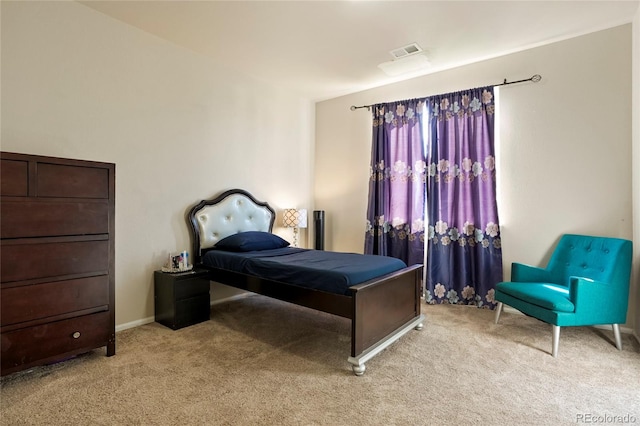 bedroom featuring light colored carpet