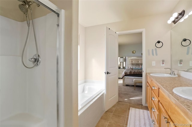 bathroom featuring vanity, separate shower and tub, and tile patterned flooring