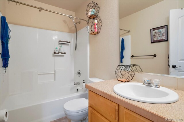 full bathroom with shower / tub combination, vanity, and toilet