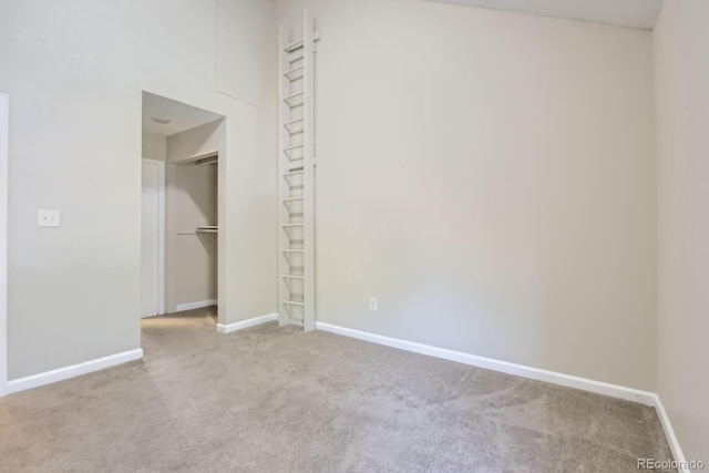 3539 S Fairplay Way Unit 10, Aurora, CO 80014 - unfurnished bedroom with carpet, baseboards, and a closet