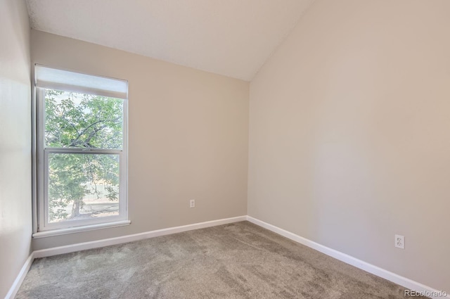 3539 S Fairplay Way Unit 10, Aurora, CO 80014 - carpeted spare room with healthy amount of natural light, baseboards, and vaulted ceiling