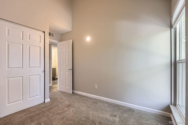 3539 S Fairplay Way Unit 10, Aurora, CO 80014 - unfurnished bedroom featuring carpet floors and baseboards