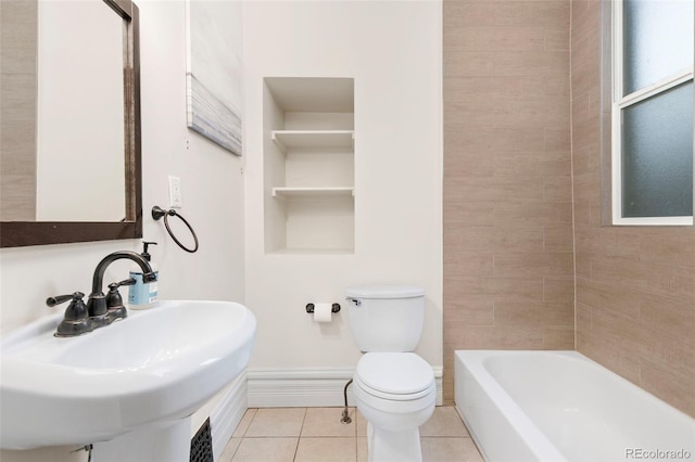 bathroom with tile patterned flooring, toilet, and sink