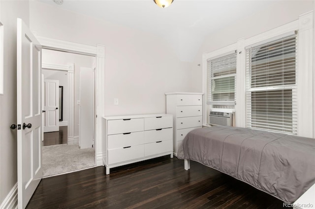 bedroom featuring cooling unit and dark wood-type flooring