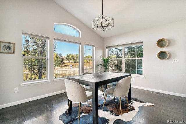 dining area featuring an inviting chandelier, visible vents, dark wood-style floors, and baseboards