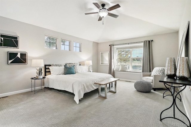 carpeted bedroom with a ceiling fan, visible vents, vaulted ceiling, and baseboards