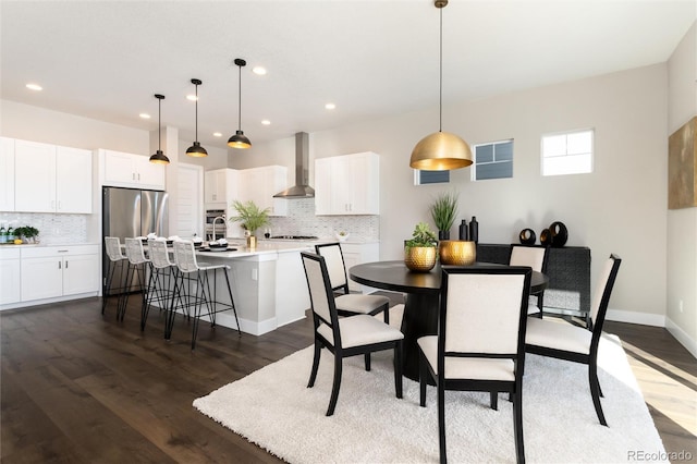 dining room with dark wood-type flooring