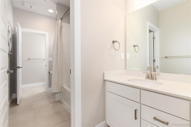 bathroom featuring vanity, tile patterned floors, and shower / bath combo with shower curtain