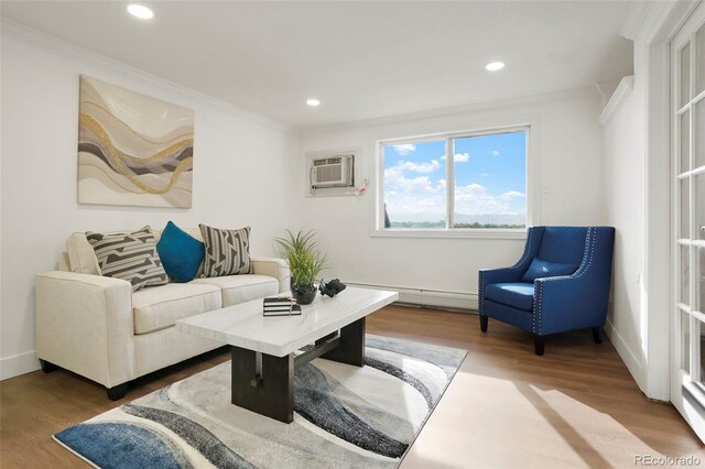 3047 W 47th Ave Unit 607, Denver, CO 80211 - living area with wood finished floors, crown molding, a baseboard heating unit, recessed lighting, and baseboards
