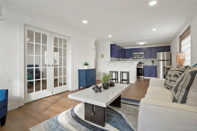 3047 W 47th Ave Unit 607, Denver, CO 80211 - living area featuring wood finished floors, ornamental molding, recessed lighting, and french doors