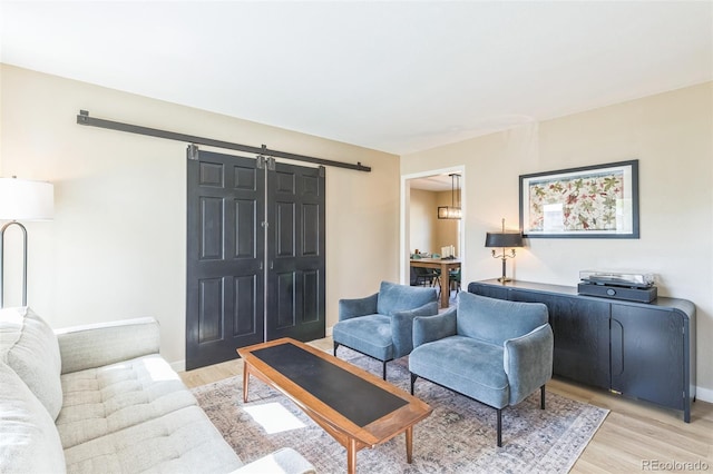 3730 Applewood St, Grand Junction, CO 81506 - living room with light wood-type flooring and a barn door