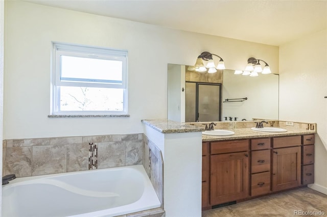 3730 Applewood St, Grand Junction, CO 81506 - bathroom featuring a sink, a bath, a shower stall, and double vanity