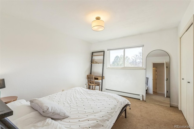 3730 Applewood St, Grand Junction, CO 81506 - bedroom featuring a closet, a baseboard radiator, and light carpet