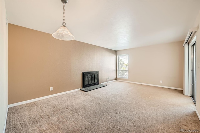 unfurnished living room featuring carpet floors