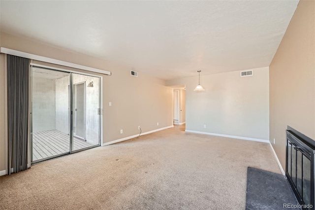 unfurnished living room with carpet