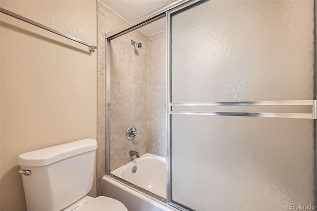 bathroom with toilet and enclosed tub / shower combo