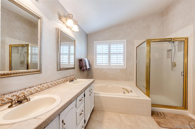 6454 S Nelson Way, Littleton, CO 80127 - full bath featuring lofted ceiling, double vanity, a garden tub, a shower stall, and tile patterned flooring