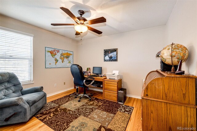 6454 S Nelson Way, Littleton, CO 80127 - home office featuring ceiling fan, wood finished floors, and baseboards