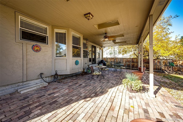 6454 S Nelson Way, Littleton, CO 80127 - deck featuring a fenced backyard, outdoor dining area, a ceiling fan, and a patio area