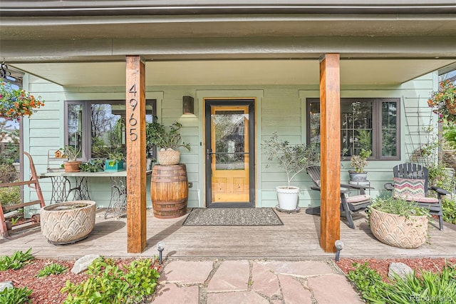 entrance to property featuring a porch