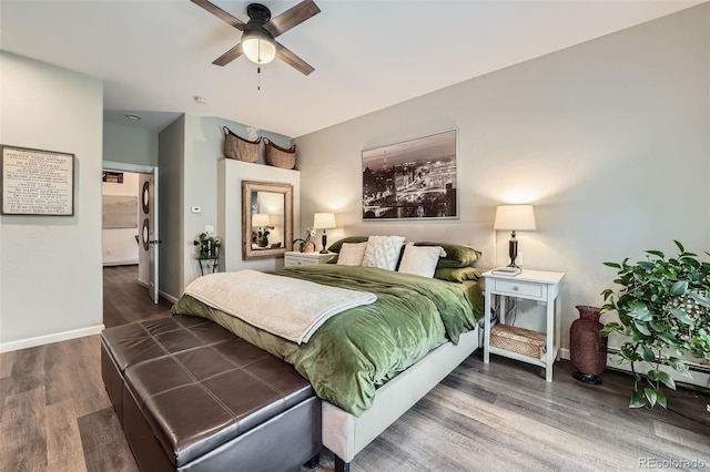 bedroom featuring baseboards, a ceiling fan, and wood finished floors